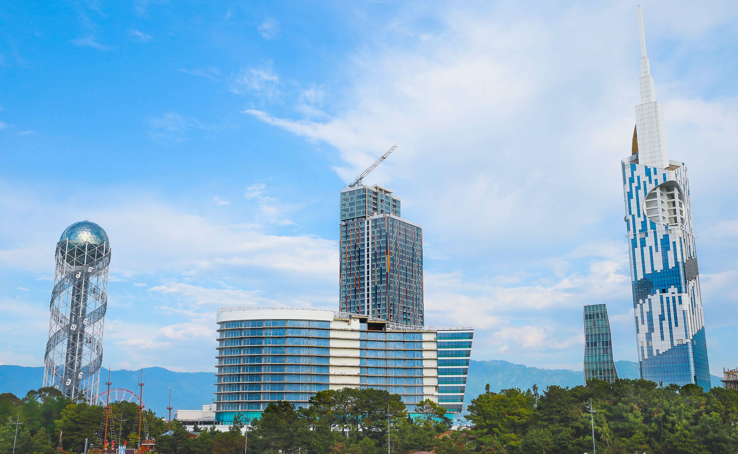 Batumi skyline on the Black Sea at day, glass towers along the curve of the Adjara coast.