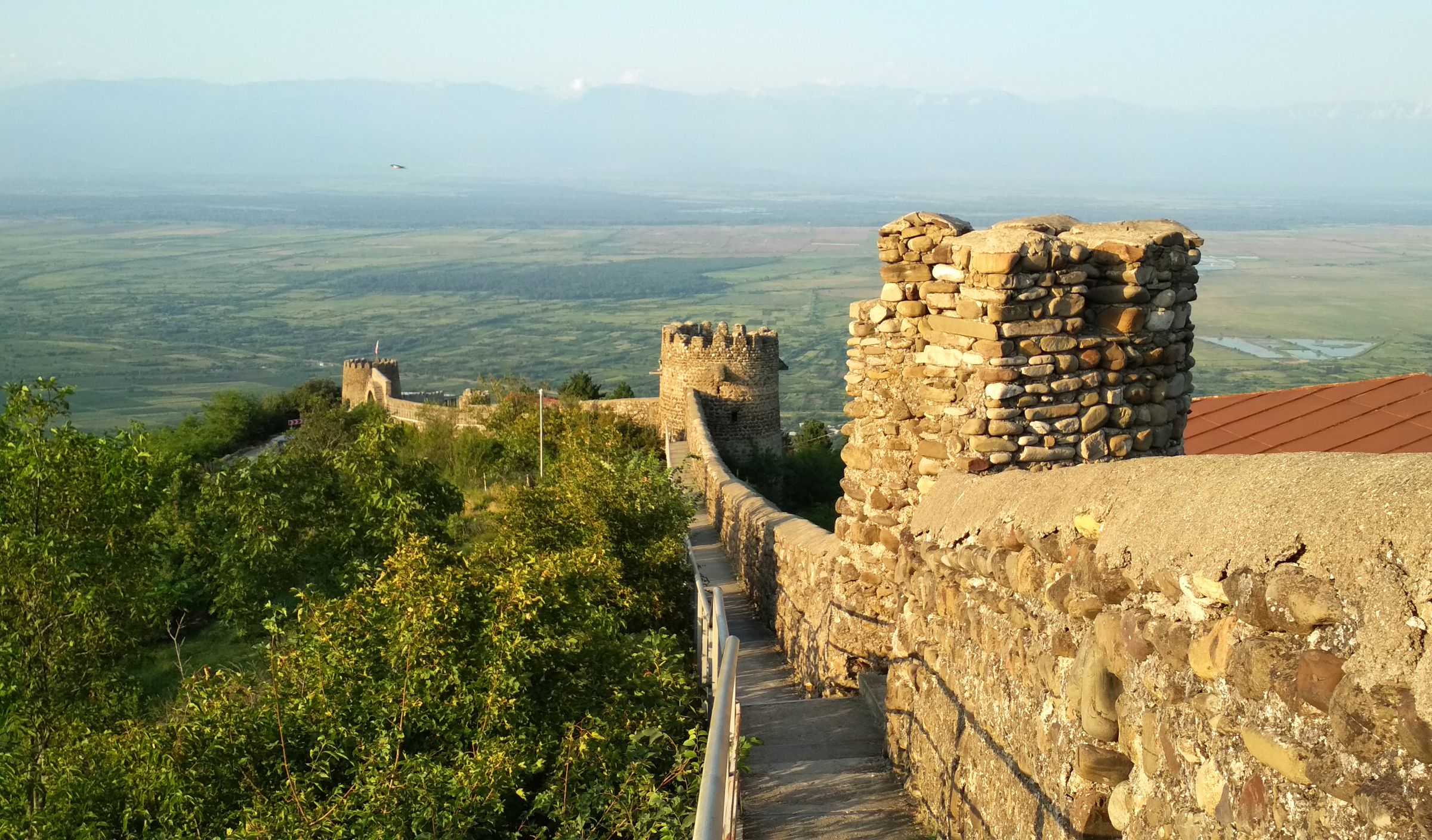 The old city walls of Sighnaghi above the Alazani valley